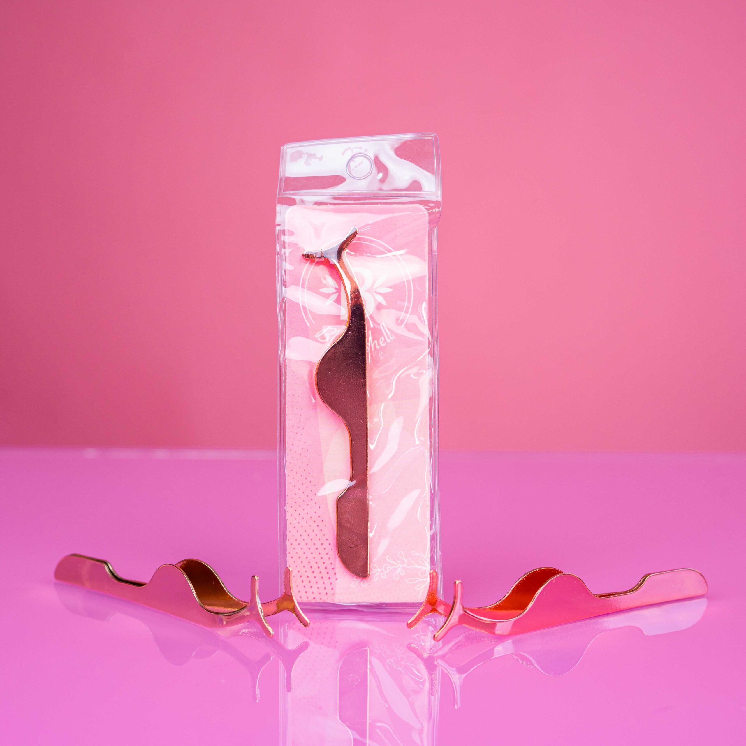 pinza para pestañas bloomshell