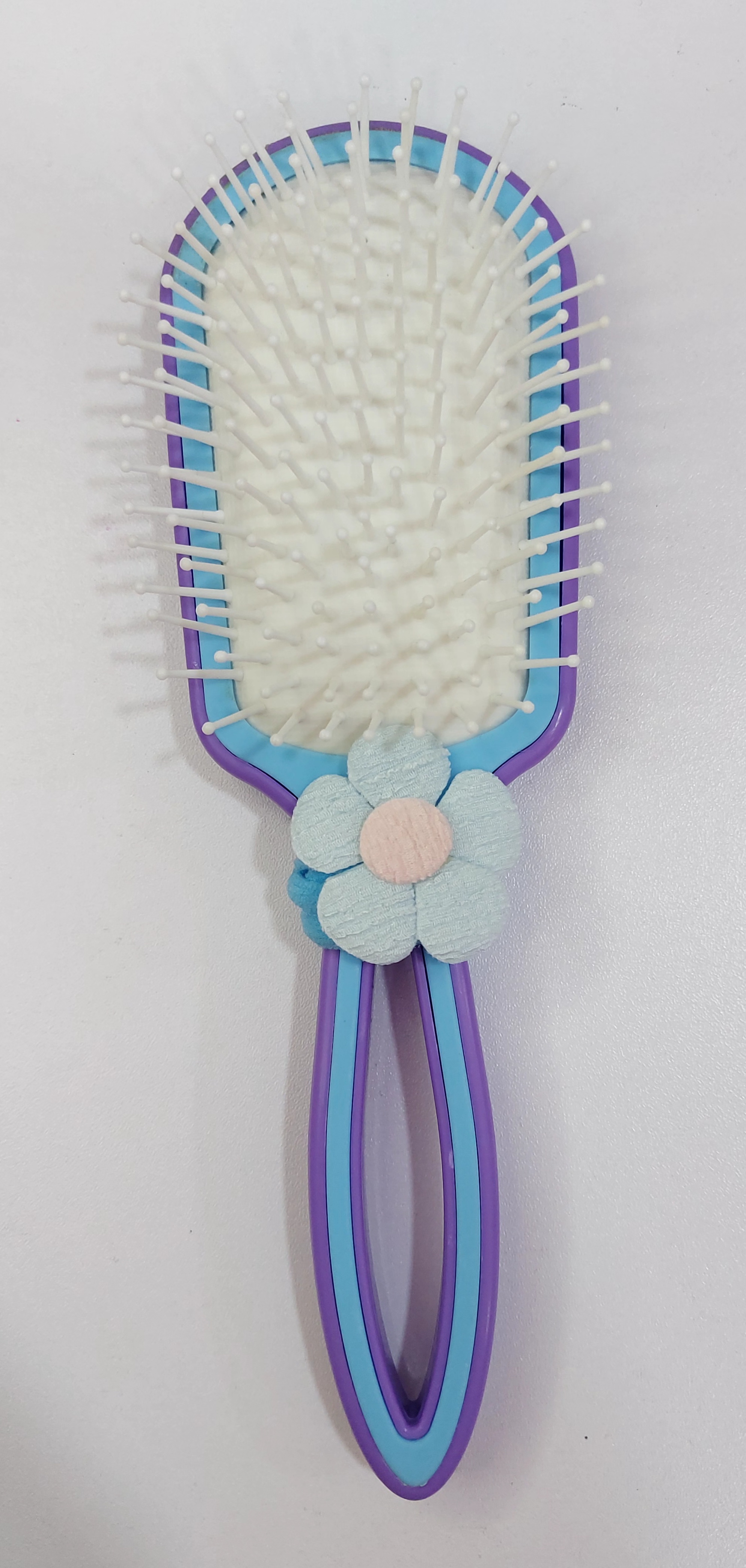 Cepillo desenredante anti friz con moña